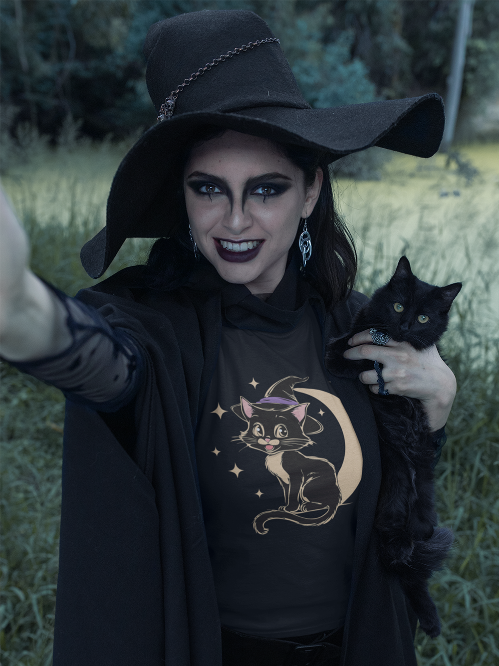 Witchy Kitty Softstyle T-Shirt - Halloween Graphic Tee with Black Cat and Witch Hat with Crescent Moon Print